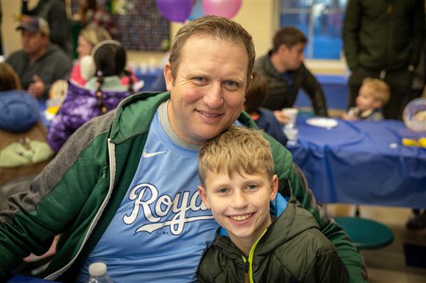 dad and son smiling